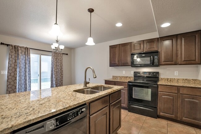 Building Photo - Pet Friendly Townhome w attached 2 car garage