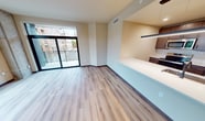 This contemporary apartment, located at 531 W Washington Ave in Madison, WI, offers 1070 square feet of thoughtfully designed living space. The single-floor layout encompasses four bedrooms, including a spacious 150 sq ft primary bedroom, and two well-appointed bathrooms. The heart of the home showcases an open-concept design, seamlessly blending living and dining areas. Large windows flood the space with natural light, while a balcony provides a connection to the outdoors. The kitchen features sleek cabinetry and stainless steel appliances, complemented by a convenient breakfast bar. Throughout the apartment, modern light fixtures and ceiling fans enhance both aesthetics and comfort. The bathrooms boast clean lines with modern vanities and fixtures. Ample closet space and a dedicated hallway contribute to the apartment's functionality. Durable and stylish wood-look flooring unifies the space, creating a warm and inviting atmosphere. This apartment combines urban convenience with contemporary design, offering a comfortable and stylish living environment in the heart of Madison.