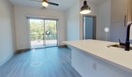 Step into a world of contemporary elegance and effortless living at Aura 235. This stunning 790 square foot home is a testament to modern design and smart living, offering two beautifully appointed bedrooms and a luxurious bathroom. The heart of this home is the chef-inspired kitchen, where culinary dreams come to life. Gleaming quartz countertops, sleek stainless steel appliances, and stylish pendant lighting create an ambiance that's both functional and fashionable. The open concept layout seamlessly connects the kitchen to the living areas, perfect for entertaining or quiet evenings at home. Large windows flood the space with natural light, creating an airy and inviting atmosphere throughout. The primary bedroom, a spacious 150 square feet, serves as a personal retreat, while the second bedroom offers versatility as a guest room or home office. High-quality finishes, including soft carpeting in the bedrooms and durable wood-look flooring in the main living areas, add to the home's refined aesthetic. The bathroom showcases a modern vanity with ample storage and a large mirror, embodying both style and practicality. This North Chesterfield gem is more than just a home; it's a lifestyle upgrade, offering the perfect canvas for your aspirations and dreams to unfold in elegant comfort.
