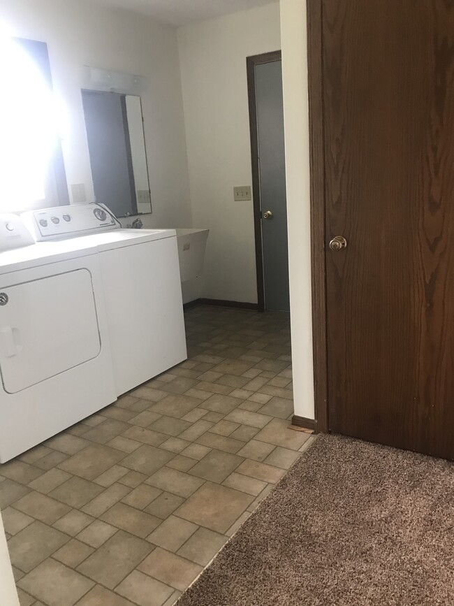 1st floor laundry room with washer, dryer and utility sink - 5480 Beechwood ave