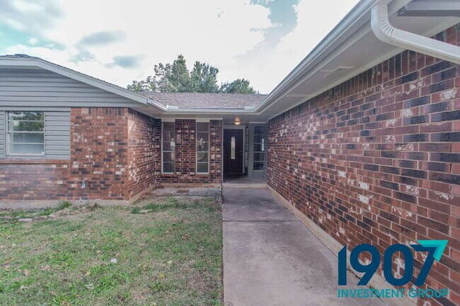 Building Photo - Spacious 4-Bedroom Home with Charming Brick Fireplace and Updated Flooring in Moore!