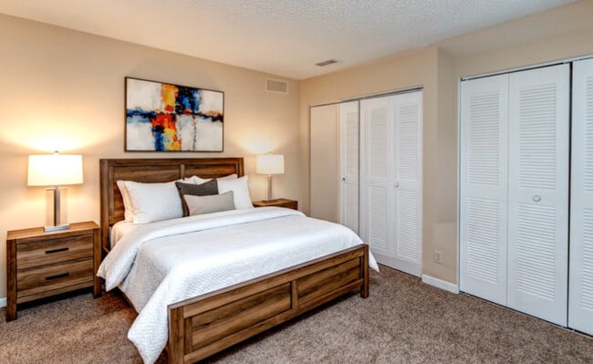 Carpet in bedroom - Golf Villas at Sabal Palm Apartments