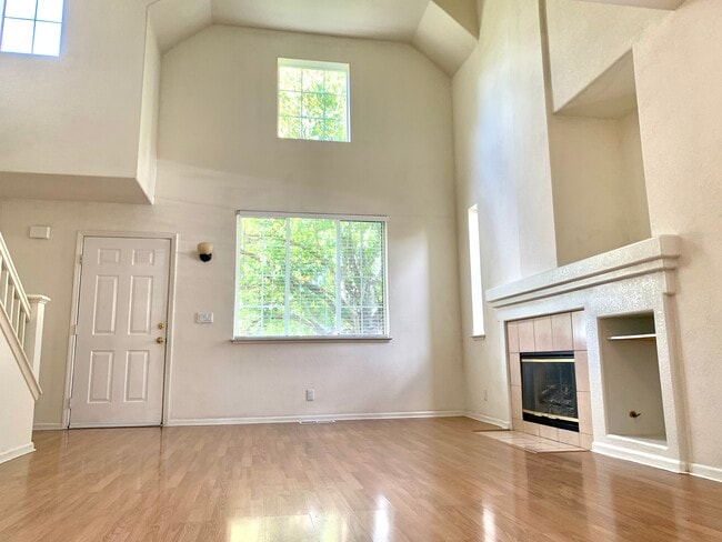 living room with Cathedral ceilings and gas log fireplace - 2306 Francisco Ave