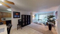 Located at 1928 Colgrove Ave in Kalamazoo, Michigan, this single-floor residence offers a well-organized layout with comfortable living spaces throughout. The open living room features a blend of tile and plush carpet flooring, a textured ceiling, and a large window that draws in natural light while offering views of the outdoors. The space flows naturally from the entry area into the main living zone, providing a welcoming and functional arrangement. Adjacent to the living room, a dedicated dining area accommodates a full-sized table and chairs beneath a ceiling fan with light fixture, making it ideal for everyday meals or entertaining. The galley-style kitchen is outfitted with warm wood cabinetry, ample counter space, tile flooring, and essential appliances including a refrigerator, dishwasher, and range. Two bedrooms provide comfortable retreats, each finished with soft carpeting and windows for natural light. The primary bedroom is generously sized, while the second bedroom offers a cozy, well-proportioned space. Two bathrooms serve the residence — one featuring a tub/shower combination with classic blue tile accenting, and the other a shower with a framed mirror vanity. Light-toned tile flooring is consistent across the wet areas, contributing to a cohesive and clean aesthetic throughout the home.