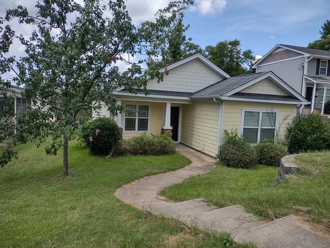 Building Photo - Great three bedroom two bath home Close to...