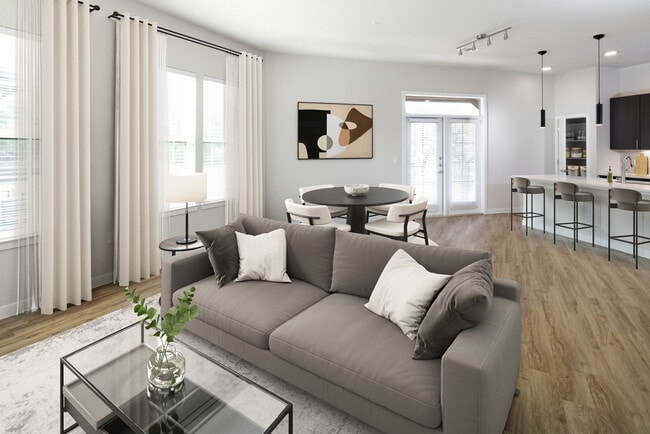 Comedor y sala de estar con piso de superficie dura. - Avalon Townhomes Bee Cave