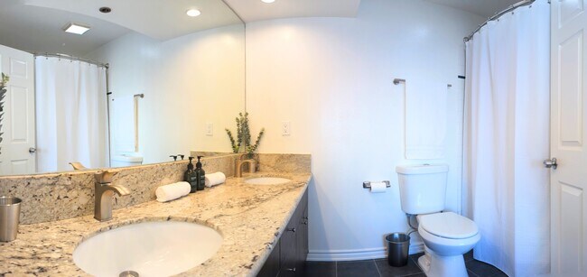 Master Bathroom with Dual Sink, wall-to-wall mirror, and great lighting. - 995 Figueroa Ter
