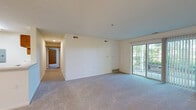 Located at 234 Mallard Point Drive in Akron, Ohio, this single-floor residence offers a well-organized layout with two bedrooms and two bathrooms across a generous floor plan. The open living room is bright and spacious, featuring plush carpeting, recessed lighting, a ceiling fan, and large sliding glass doors that lead to a private patio with lush, tree-lined outdoor views. Natural light flows freely throughout the space, creating a welcoming atmosphere.

The galley-style kitchen is functional and efficient, finished with warm wood cabinetry, white countertops, and durable hardwood-style flooring. It connects seamlessly to the living and dining area, making the space ideal for everyday living.

The primary bedroom is generously sized, featuring soft carpeting, two windows that invite abundant natural light, and a ceiling fan for added comfort. The second bedroom is also carpeted and well-proportioned, offering a clean, versatile space.

Both bathrooms are finished with warm-toned tile flooring and wood-toned cabinetry. One bathroom includes a shower stall, while the other features a full soaking tub and shower combination, providing practical options for residents. The overall design is clean, neutral, and move-in ready.