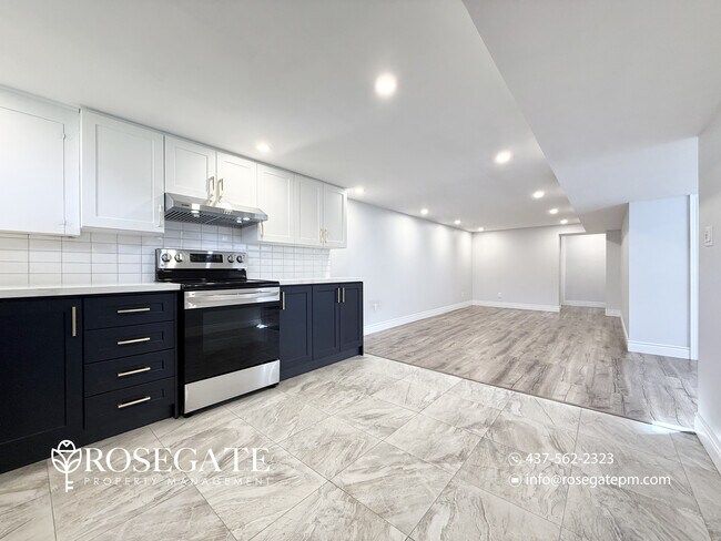 Photo du bâtiment - Pet-Friendly 2-Bedroom Basement Apartment with Parking & Free Rogers Wi-Fi