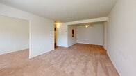 Located at 9200 Bustleton Ave, Unit 906, in Philadelphia's 19115 neighborhood, this 2-bedroom, 3-bathroom residence offers a well-organized, single-floor layout with a clean, neutral aesthetic throughout. The living room is carpeted and bright, featuring a ceiling fan and an open sightline into the adjoining dining area, creating a comfortable, connected common space. A versatile den adds flexibility for use as a home office or additional sitting room, complete with wood-look flooring and a pass-through window opening to the hallway. The kitchen is equipped with warm wood cabinetry, granite-look countertops, a gas range, refrigerator, and a stainless steel sink — all accented by durable wood-look flooring and ample overhead storage. The generously sized primary bedroom features plush carpeting, a large window with outdoor views, and access to a dedicated closet. The second bedroom also offers carpeted flooring, natural light, and a closet. Three bathrooms serve the residence, each finished with white fixtures and vanity with mirrored medicine cabinet. Four total closets provide excellent storage throughout. A dedicated utility room rounds out this functional and well-appointed home.