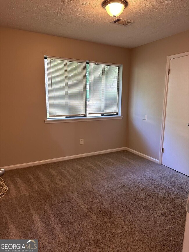 Building Photo - 9249 Woodgreen Way