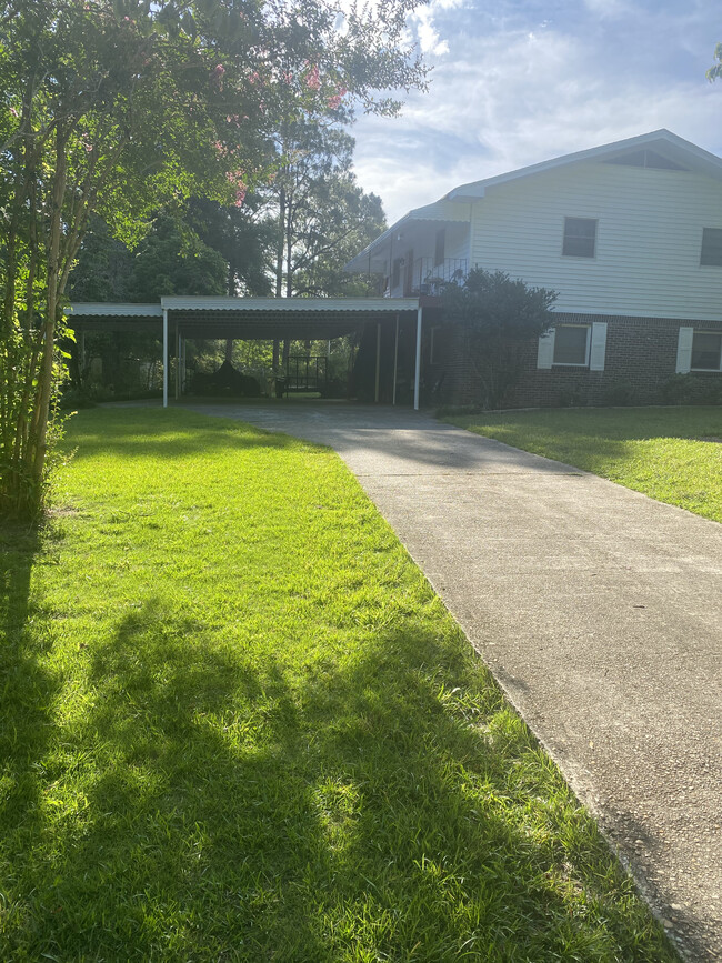 Driveway and yard to apartment - 202 Christopher Dr