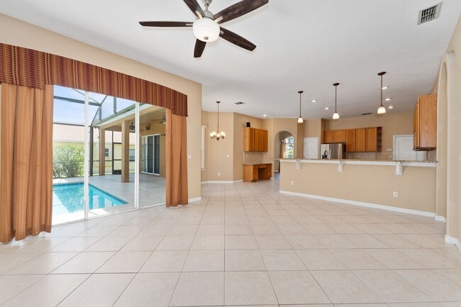 Building Photo - Spacious 4/3 Pool Home in the Gated Lake F...
