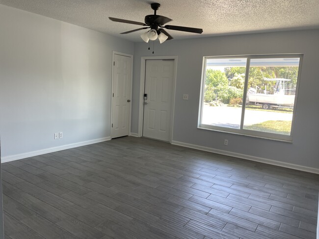 Welcoming living room with large window - 7669 SE James St