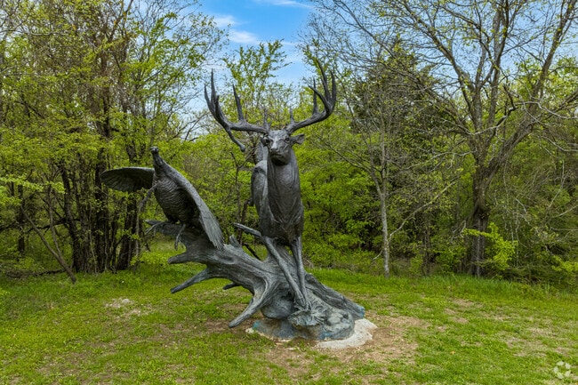 The whitetail deer sculpture by artist Sherry Salari Sander is located along the Cade Branch Walking Trail.