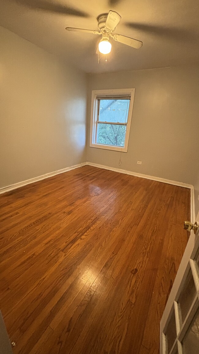 Bedroom 1 with french doors and a closet - 8046 S Maryland Ave