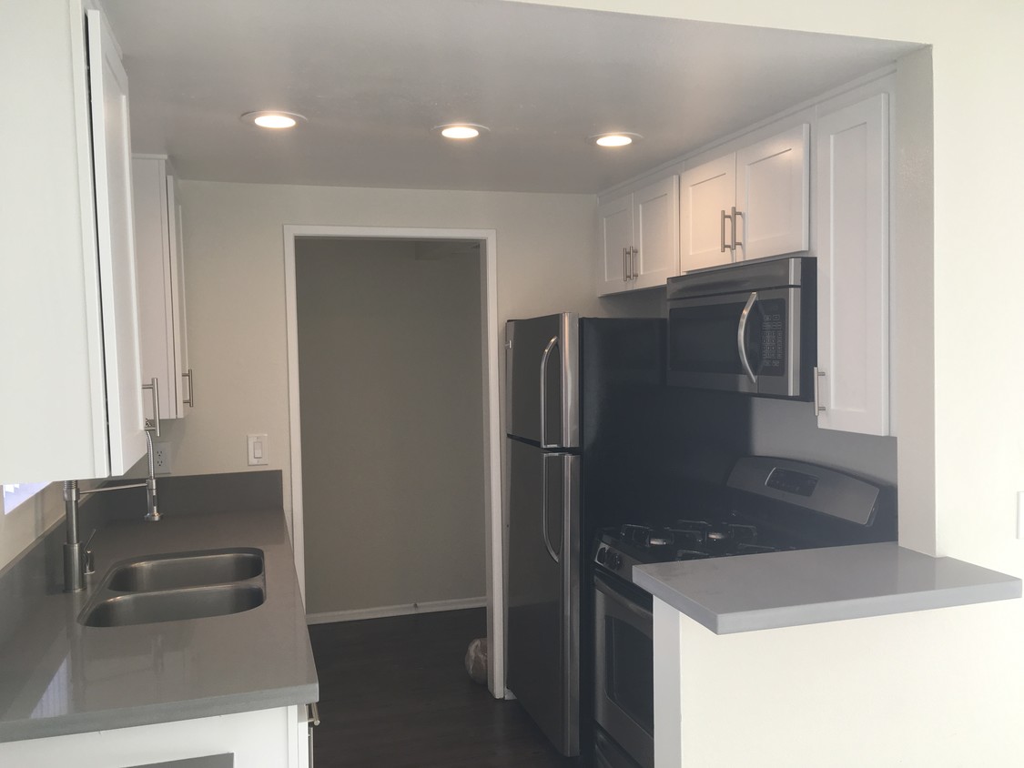 Kitchen with new quartz countertops - 110 S Sweetzer Ave