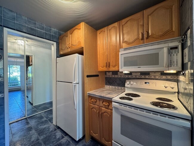 Building Photo - Watergate Garden Condo | 2 Bed, 2 Bath with Custom Tile Detail + Private Patio