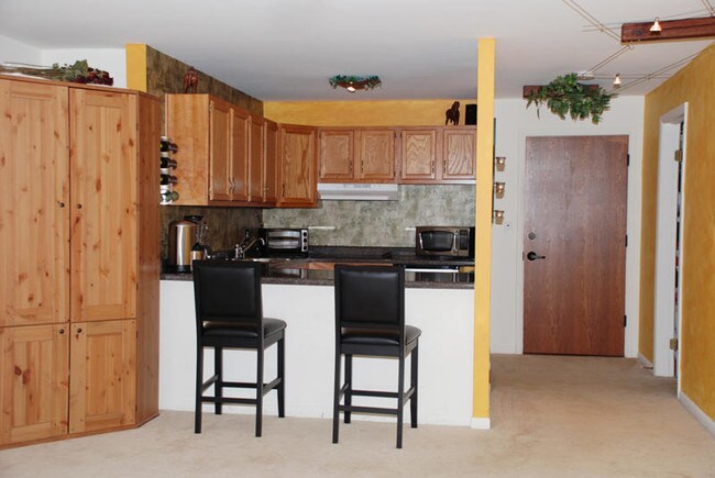Main Room Facing Kitchen (kitchen newly repainted white) - 5820 Oakwood Dr