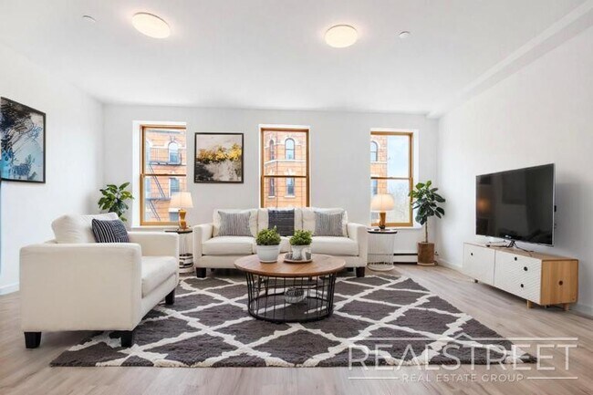 Building Photo - Full-Floor Renovated 2BR | Expansive Living Space | 1 Min to A Train