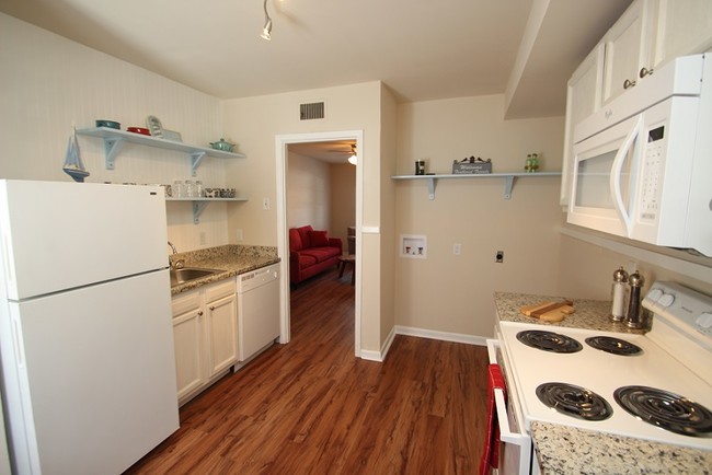 Brand new dishwasher, stove, microwave, and granite countertop - Church Hill Apartments