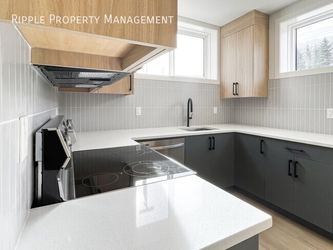 Photo du bâtiment - BRAND NEW & SUN-DRENCHED 2-BED BASEMENT | MODERN BOWNESS LIVING