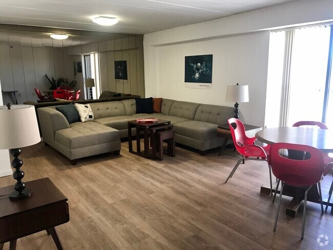 Deluxe Two Bedroom/One Bath Living Room - The Graduate Apartments