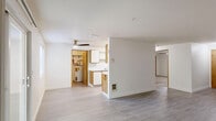 Located at 12514 SE 7th St in Vancouver, WA, this well-appointed one-bedroom, one-bathroom unit offers a thoughtfully designed single-level layout with a clean, neutral aesthetic throughout. The open living room is bathed in natural light, courtesy of large sliding glass doors that lead directly to a private patio overlooking a green outdoor space — an inviting feature that seamlessly blends indoor and outdoor living. Durable, light-toned wood-style flooring runs throughout the main living areas, lending a modern and cohesive feel to the space. The galley-style kitchen is efficiently laid out with ample white cabinetry accented by warm wood trim, light countertops, and a full suite of appliances including a stainless steel refrigerator, electric range, microwave, and dishwasher. The spacious primary bedroom features plush carpeting, a ceiling fan with integrated lighting, a large window for natural light, and two generous closets — one with mirrored sliding doors. The full bathroom includes a tub and shower combination with clean, bright finishes and contemporary brushed nickel hardware. With two closets providing excellent storage, this unit delivers both comfort and practicality in a compact, efficiently organized floor plan.
