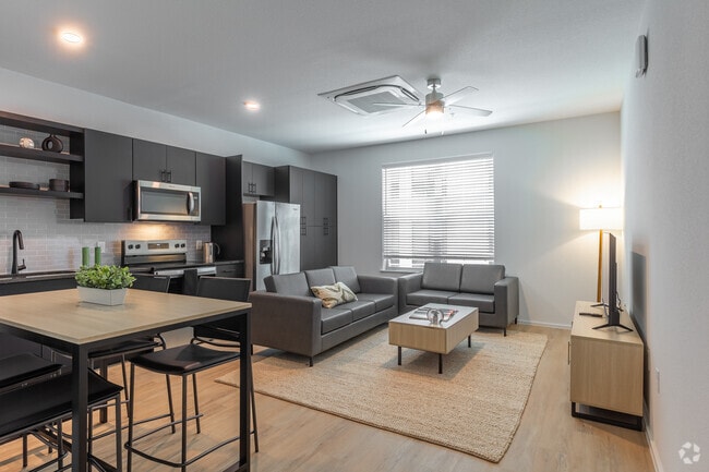 4BR, 4BA - 1,308SF - Living Room - UNITi Bishop Arts Apartments