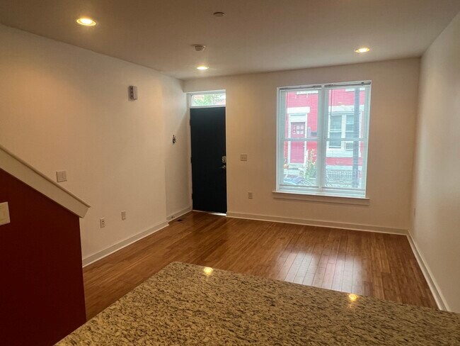 Living room with hard-wood floors and plenty of natural light (with dimmable interior lights). - 3013 W Cabot St