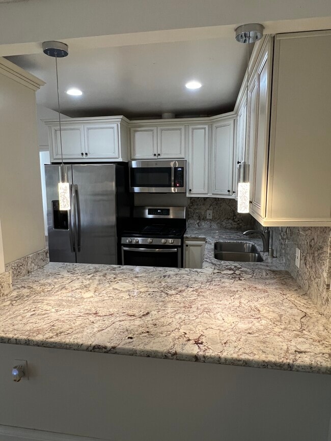 Stainless Refrigerator & Stove - 19156 Avenue of the Oaks