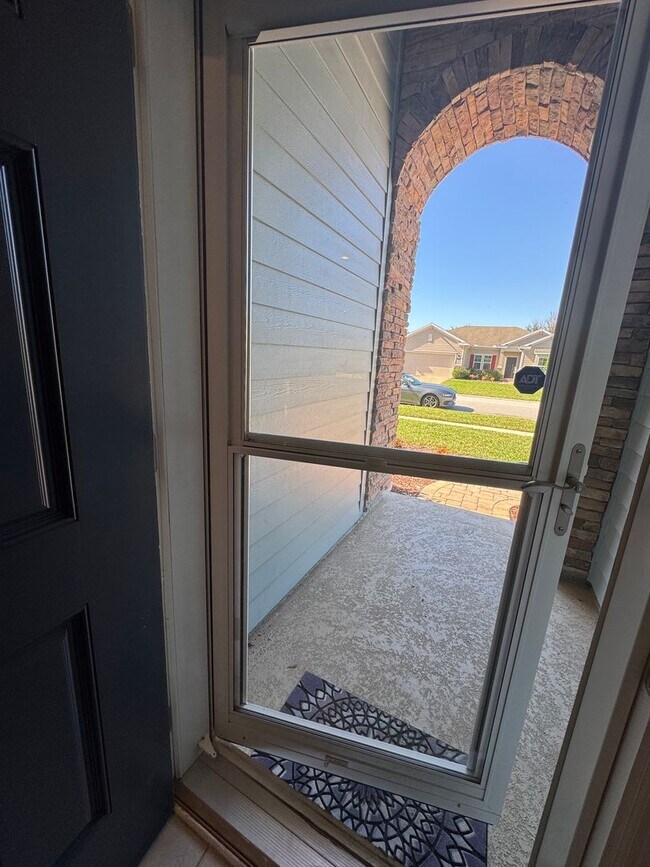 Building Photo - COMING SOON! Beautiful 4BR 3BA Home w/ Screened Lanai & Pond View • Garage Parking • Fenced Yard ...