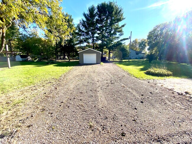 Driveway to detached garage. - 2145 Grand Ave