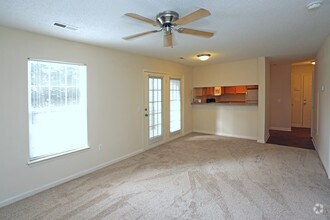 Standard Carpeted Living And Dinning Room - The Amesbury on West Market