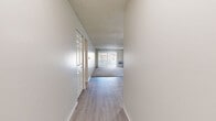 Located at 998 S Miller Way in Lakewood, Colorado, this two-bedroom, two-bathroom residence offers a thoughtfully arranged single-floor layout with a clean, neutral aesthetic throughout. The living room is a bright, open space featuring light wood-style flooring, plush carpet, a ceiling fan with integrated lighting, a textured ceiling, and a sliding glass door that fills the room with natural light and provides access to a private balcony. Baseboard heating runs throughout, ensuring comfortable warmth year-round. The galley-style kitchen is well-appointed with gray shaker cabinetry, granite-style countertops, stainless steel appliances including a refrigerator, range, and dishwasher, and a window that brings in additional natural light. Both bedrooms are carpeted and comfortably sized, each featuring a ceiling fan, closet storage, and windows. The primary bedroom includes ample closet space. Four closets in total provide generous storage throughout the unit. The two bathrooms are finished with light wood-style flooring and white vanities; one features a walk-in glass-door shower alongside a built-in shelving closet. Connecting hallways offer a smooth flow between living and private spaces, completing this well-organized and functional Lakewood residence.