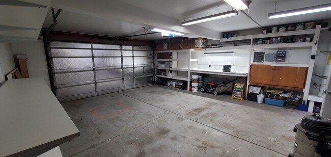 Garage has remote opener and storage space. - 17276 James Lex Ln