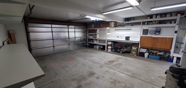 Garage has remote opener and storage space. - 17276 James Lex Ln