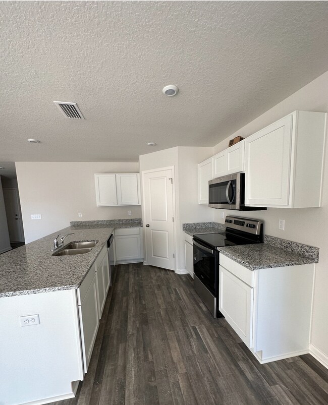 Large kitchen with island ready for bar stools. Not shown is large GE refrigerator - 5581 Lexa Ln