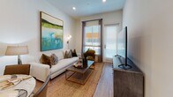Located at 6711 Sepulveda Blvd in Los Angeles, this single-floor residence offers a thoughtfully designed layout with modern finishes throughout. The entry foyer welcomes you with light wood-style flooring that flows seamlessly through the main living areas, setting a clean and contemporary tone.

The kitchen is a standout feature, outfitted with dark wood-grain cabinetry, stainless steel appliances including a side-by-side refrigerator with ice and water dispenser, a range, microwave, and dishwasher. White quartz-style countertops and a subtle tile backsplash complete the polished, functional aesthetic.

The living area is bright and inviting, featuring recessed lighting, large windows with plantation-style blinds, and access to natural light. The space offers a comfortable and open atmosphere well-suited for both relaxing and entertaining.

The bedroom is a serene retreat with ample natural light from generously sized windows, warm wood-style flooring, and direct access to the en-suite bathroom. The bathroom is elegantly finished with marble-style tile flooring, a dual-sink vanity with dark wood cabinetry, a wide illuminated mirror, and a spacious walk-in shower with floor-to-ceiling marble-look tile. The overall design of this residence balances modern sophistication with everyday comfort.