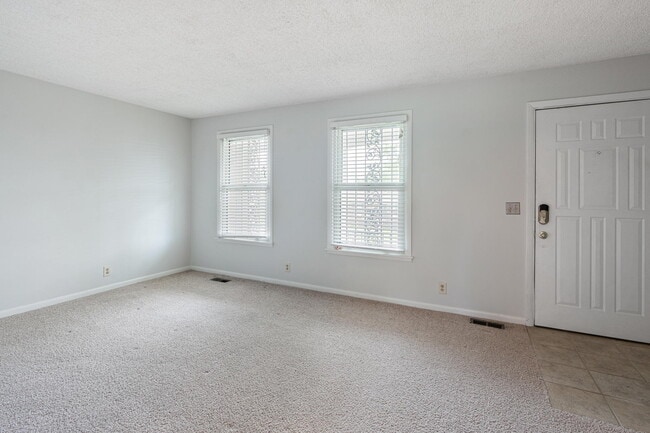 Living room and front door to porch - 3841 Dubois Dr