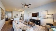 Located on Founder's Lane in Lebanon, Ohio, this single-floor residence offers a thoughtfully designed layout that maximizes comfort and functionality. The open-concept kitchen and living area serves as the heart of the home, featuring a granite-topped island with bar seating, white shaker cabinetry extending to the ceiling, stainless steel appliances, and wood-look plank flooring. Recessed lighting and a built-in sink make the kitchen as practical as it is stylish.

The living room is bright and welcoming, with a large window and a glass-paneled entry door that invite natural light throughout. A ceiling fan adds comfort, while the neutral palette and clean lines create a calm, modern ambiance.

The bedroom is carpeted and comfortably sized, featuring a closet with louvered bifold doors, a window with outdoor views, and soft, neutral tones that promote a restful atmosphere.

The bathroom includes a full tub and shower combination with white tile surround, wood-look flooring, and brushed nickel fixtures for a clean, cohesive finish. A dedicated utility room provides added convenience with in-unit laundry hookups. Throughout the residence, consistent neutral tones and modern finishes create a cohesive, move-in-ready living environment.