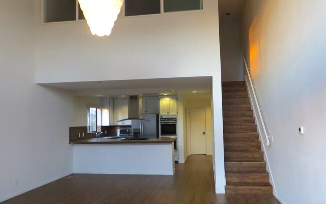 kitchen, stairs to open room. - 3968 Inglewood Blvd