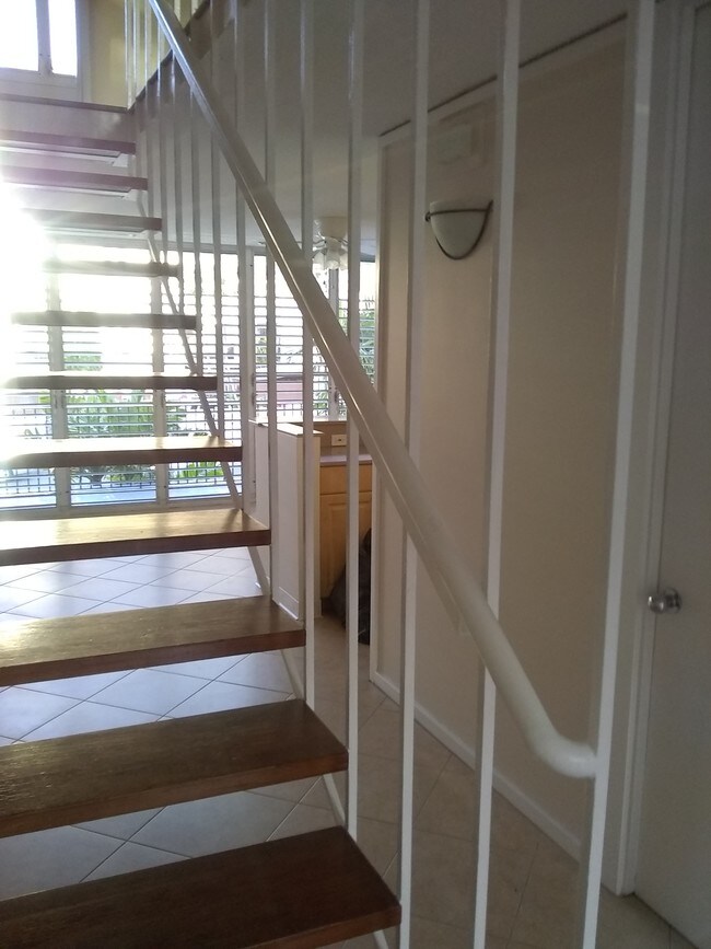 View through stairs to dining area - 3030 Pualei Cir