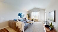 Located at 6650 Liberty Grand Blvd. in Powell, Ohio, this single-floor residence offers a thoughtfully designed open-concept layout that promotes a seamless flow between living spaces. The living room is a standout feature, boasting vaulted ceilings that lend an airy, expansive feel to the space, complemented by large windows that invite an abundance of natural light and views of the surrounding landscape. Plush carpeting throughout adds comfort underfoot.

The kitchen is well-appointed with rich, dark cabinetry, stainless steel appliances, and hardwood-style flooring. A central granite-topped island with pendant lighting above serves as both a functional workspace and a casual dining area with bar seating, connecting effortlessly to the living space.

The bedroom is a comfortable retreat, featuring carpeted floors, a ceiling fan, and a window that allows natural light. A generously sized walk-in closet with wire shelving provides ample storage.

The bathroom is finished with wood-style flooring and includes a glass-door walk-in shower. An in-unit laundry area adds everyday convenience. Throughout the residence, neutral tones and clean architectural lines create a cohesive, modern aesthetic.