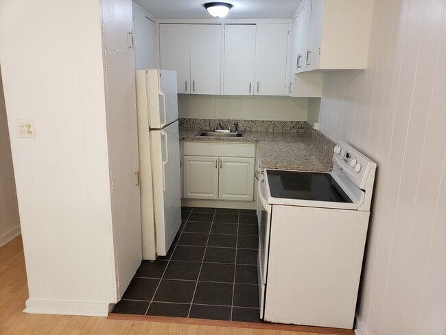 Unit C- View of the kitchen with full size appliances. - 47 -411 Kamehameha Hwy