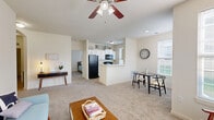 Located at 5457 Winding River Rd in Noblesville, Indiana, this single-floor residence offers 2 bedrooms and 2 bathrooms within a well-organized, efficient layout. The heart of the home is a bright, open-concept space that seamlessly combines the living room, dining area, and kitchen. The living room features plush carpeting, a ceiling fan with light, and multiple windows that invite generous natural light, along with a glass door providing outdoor access. The galley-style kitchen is equipped with white cabinetry, light countertops, black appliances including a range and dishwasher, and wood-look flooring, with a window overlooking the outdoors. A peninsula counter connects the kitchen to the dining area, creating a practical flow throughout. The primary bedroom is a comfortable, carpeted retreat with a large window, while the second bedroom also features carpet flooring, a ceiling fan, and its own window. Both bathrooms are well-appointed, with one featuring a tub/shower combination and wood-look flooring. A dedicated laundry room houses a washer, water heater, and HVAC unit. Five closets throughout the home provide ample storage, completing this functional and inviting residence.