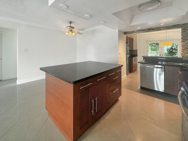 View of dining room that sits in front of open kitchne - 6001 NW 71st Ave