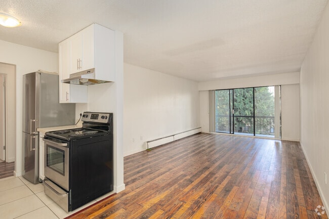 1BR, 1BA - 650SF - Living Room and Kitchen - Amber Lodge