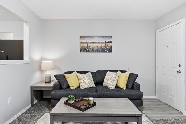 Bright, open-concept living room with space to relax or entertain. - Edmond at Twenty500