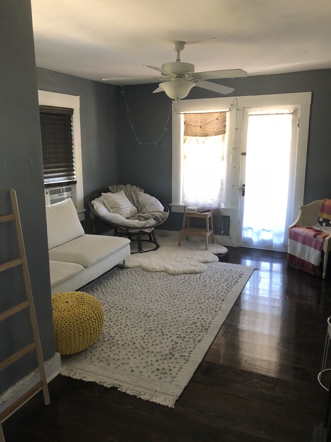 Living room with private balcony (furnishings not included) - 2212 N Massachusetts Ave